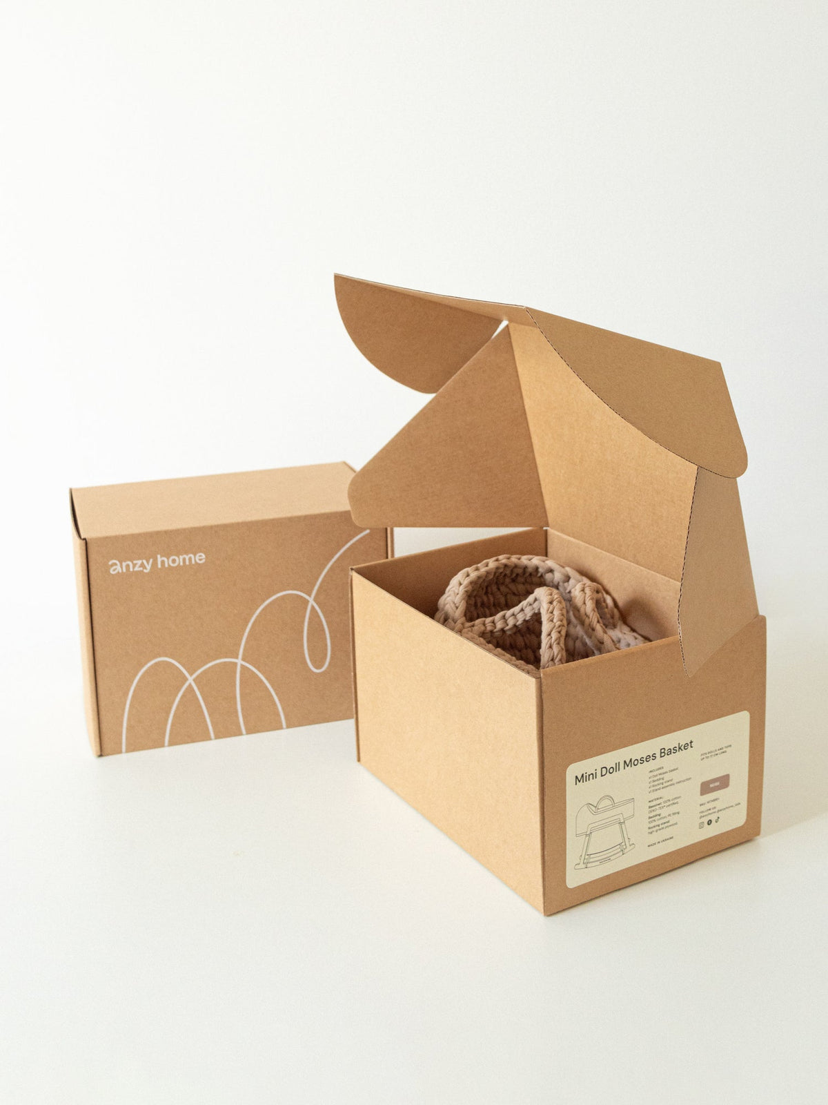 Mini doll Moses basket in open cardboard box for retail packaging