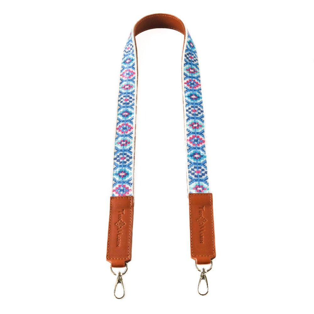 Mai woven bag strap with blue and pink pattern, tan leather ends and metal rings