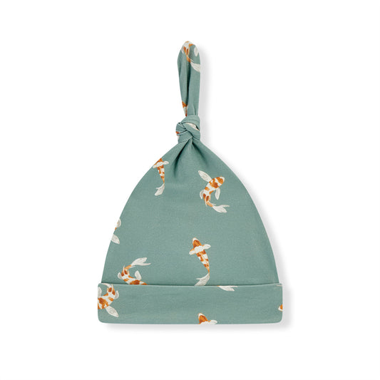 Teal cotton stretch beanie with knotted top and koi fish pattern, ribbed cuff