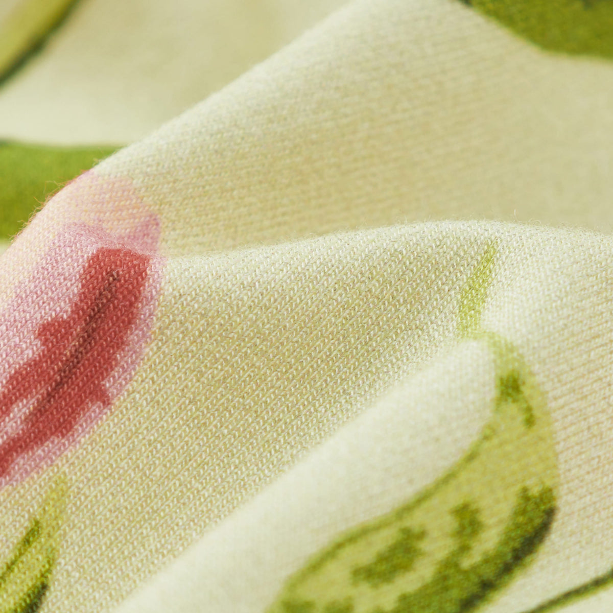 Close-up of floral knit fabric texture for a stretchy knotted beanie hat