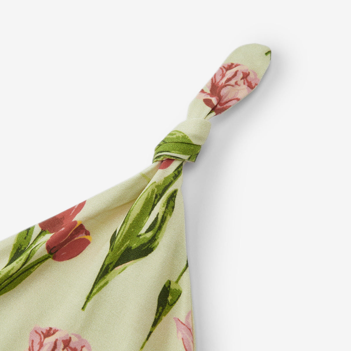 Floral knotted beanie hat with tulip-print top knot and folded band