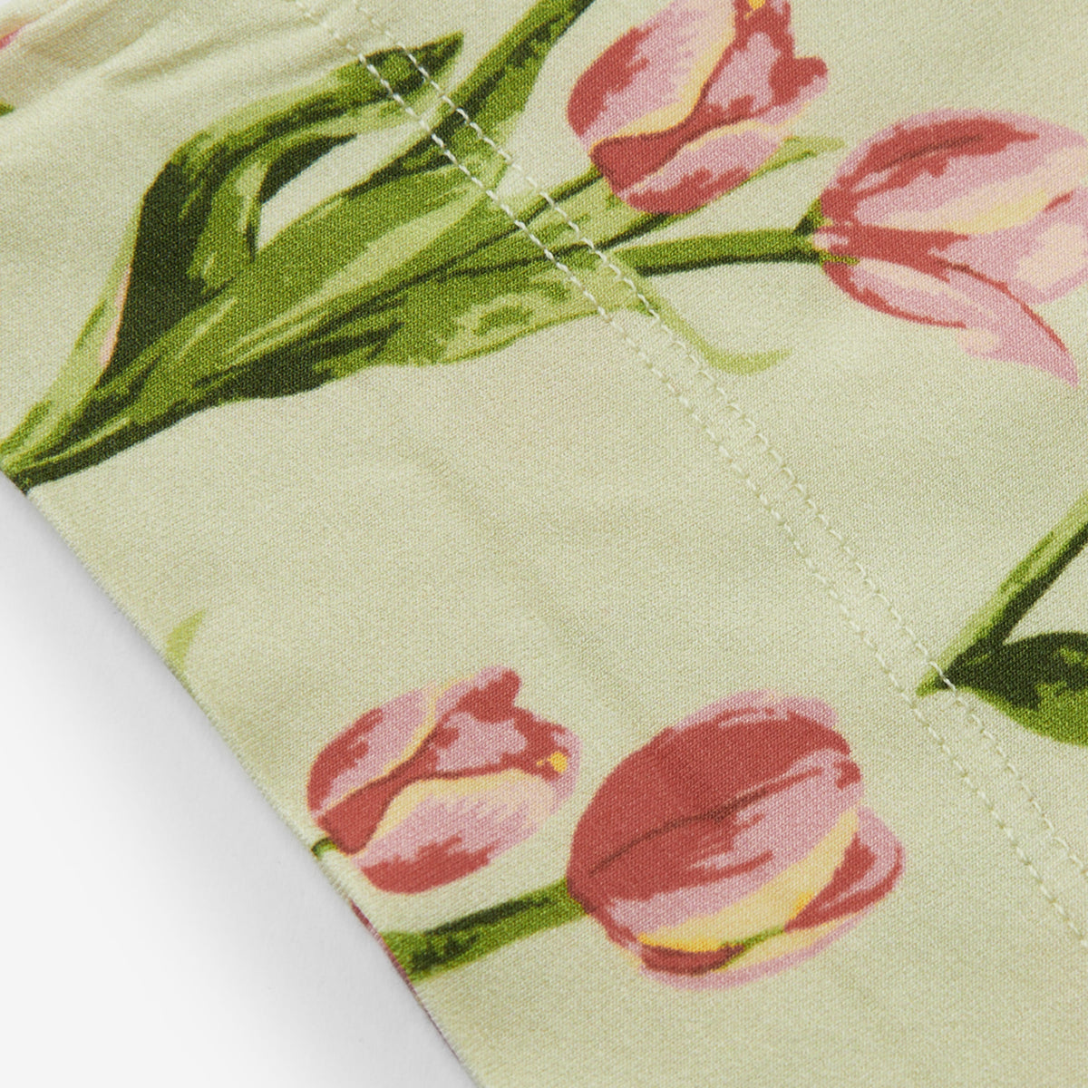 Floral beanie hat hem with tulip print and neat stitched seam