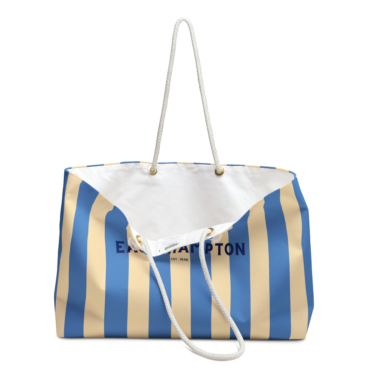 Striped weekender tote with rope shoulder straps and open top showing interior label