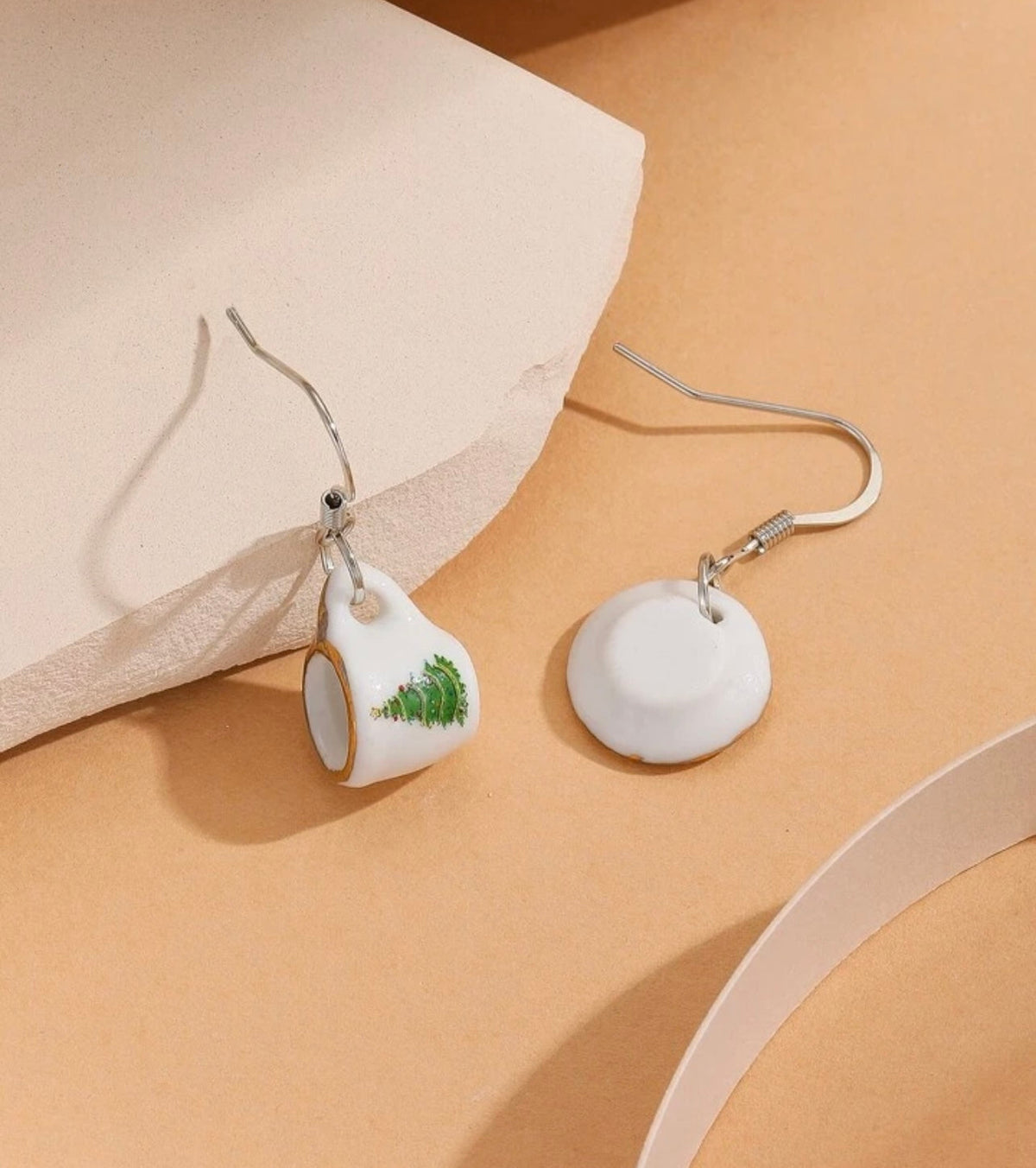Tea cup and round dangle earrings with green Christmas tree motif and silver hooks