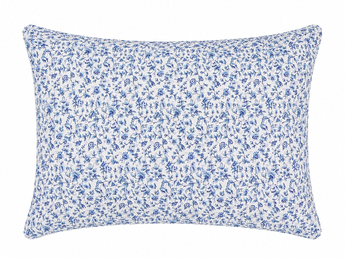 Pillowcase with a dense blue floral print on white