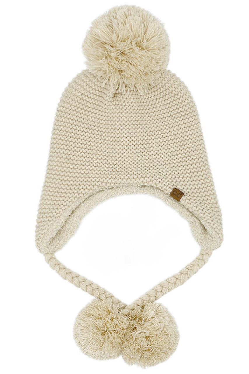 Beige knitted trapper beanie with yarn pom top and two pom ear flaps