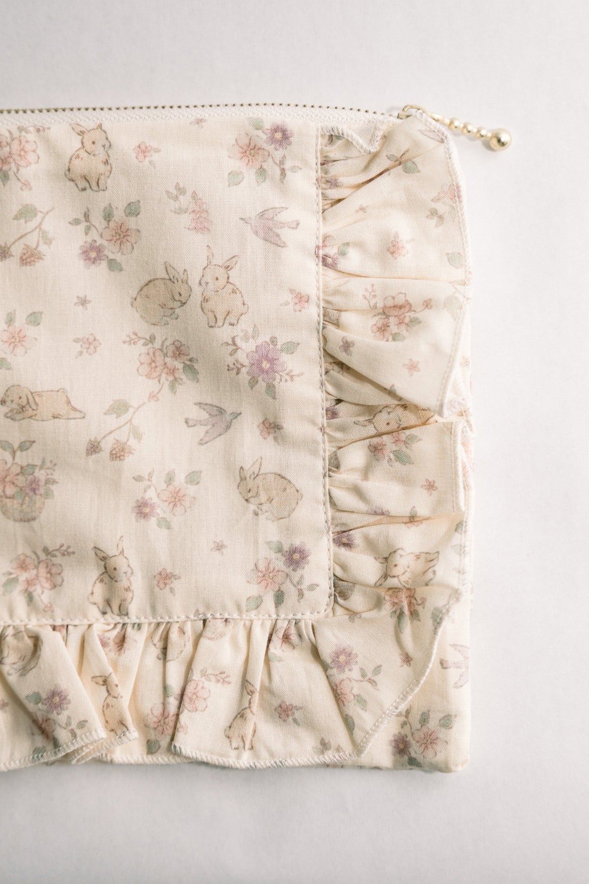 Woodland floral ruffle zipper pouch corner detail with small bead pull and pleated trim