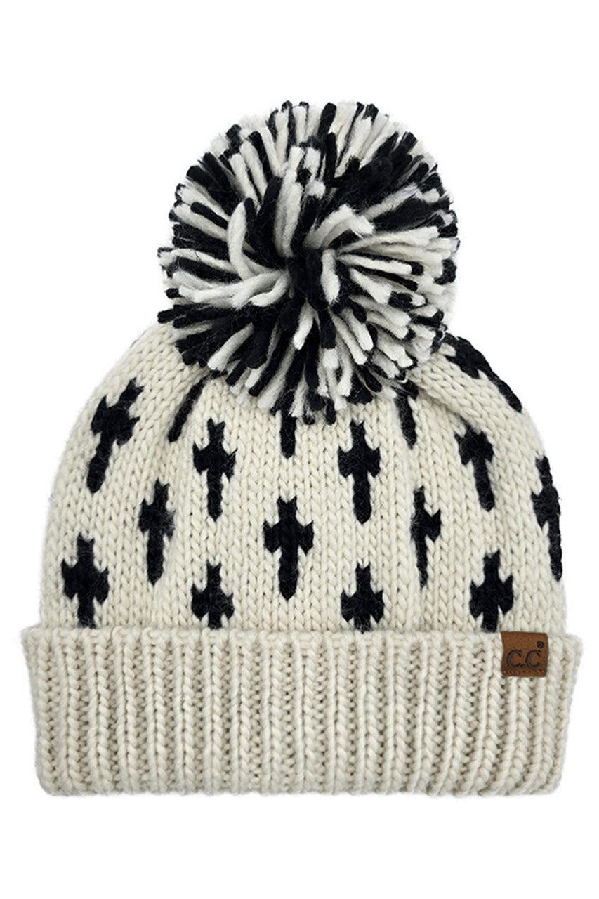 Cream knit beanie with black cross pattern, large pom-pom, ribbed cuff, C.C patch
