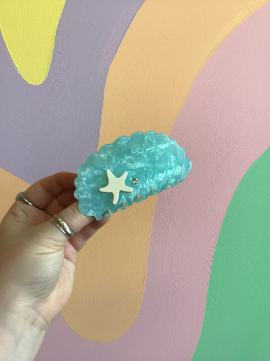 Blue Crush shell hair claw, teal blue scalloped shell with star emblem