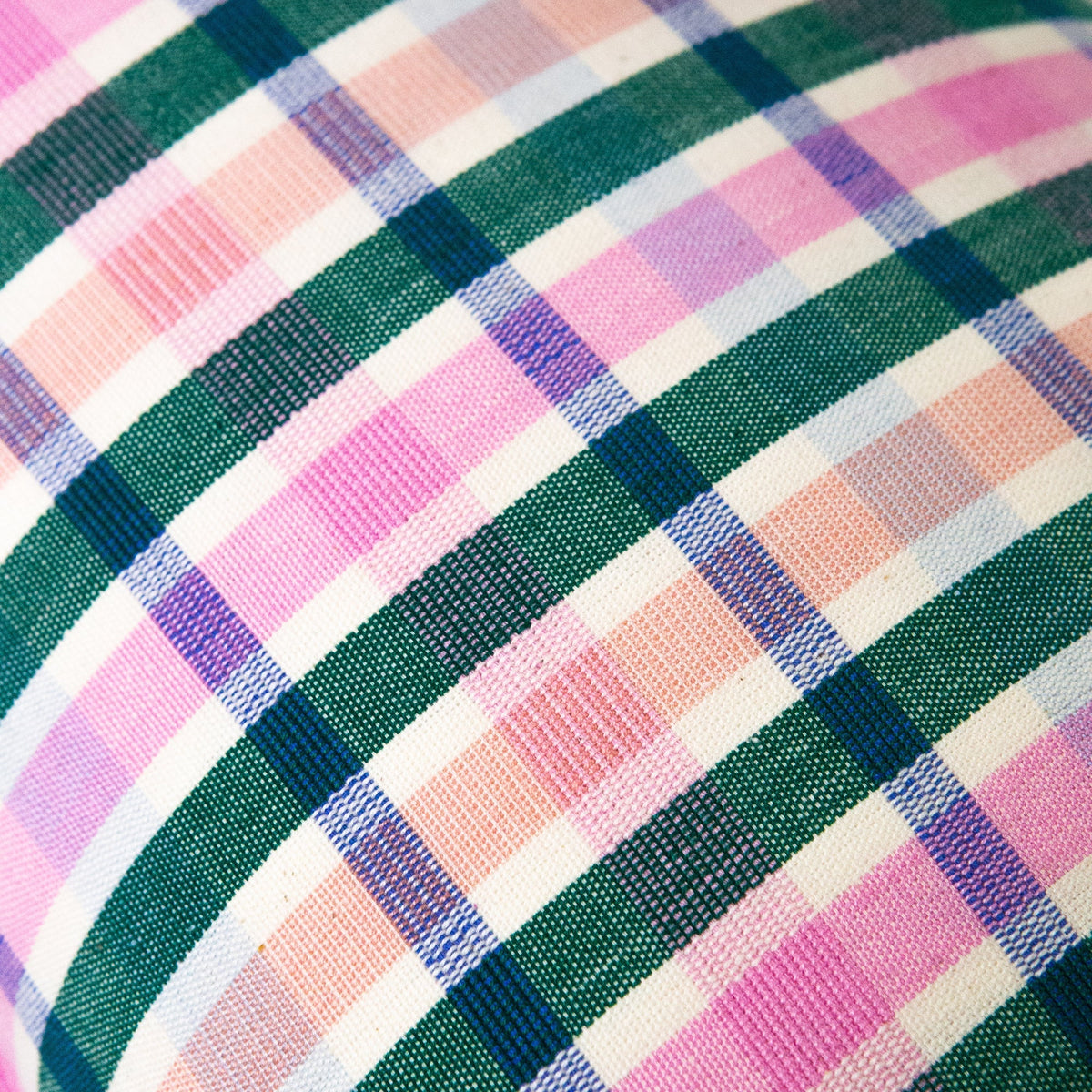 Close-up fabric view of multicolor plaid weave for ruffle pillow