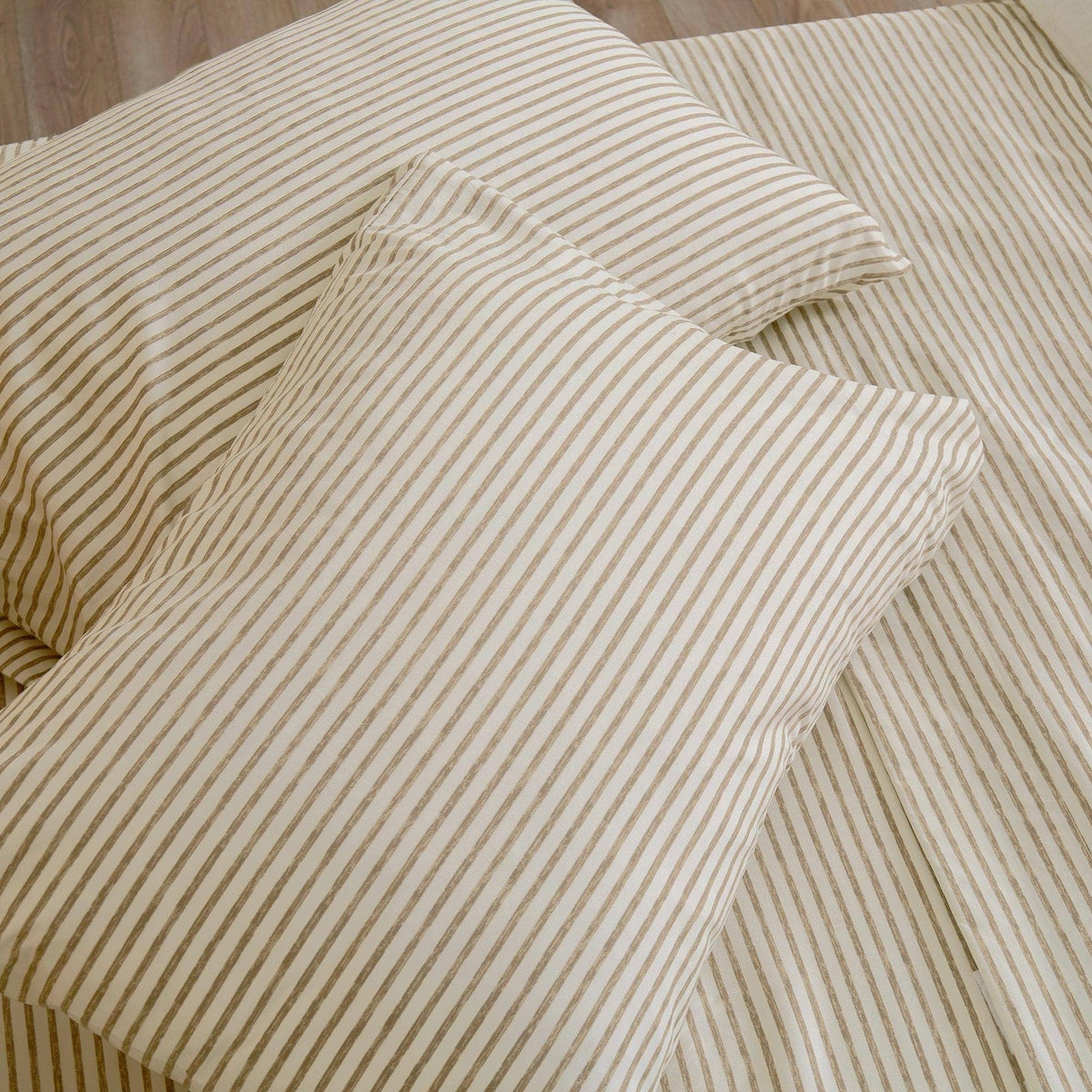 Microfiber sheet set with tan and white striped duvet cover