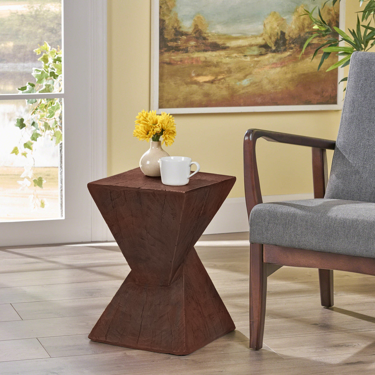 TESS dark brown side table with an hourglass-shaped base and wood-like texture
