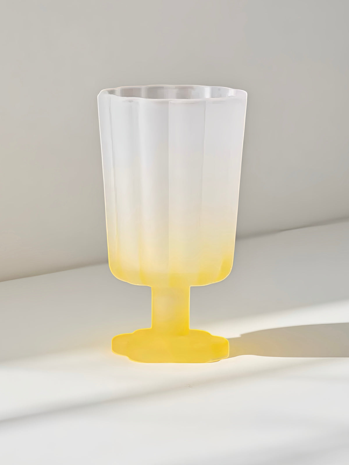 Yellow petal goblet with flared rim and yellow stem pedestal base