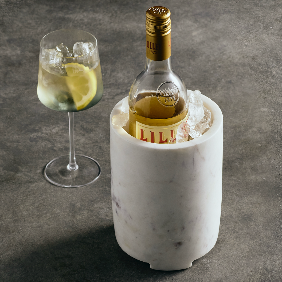 Cova wine chiller marble-look ice bucket holding a wine bottle and ice
