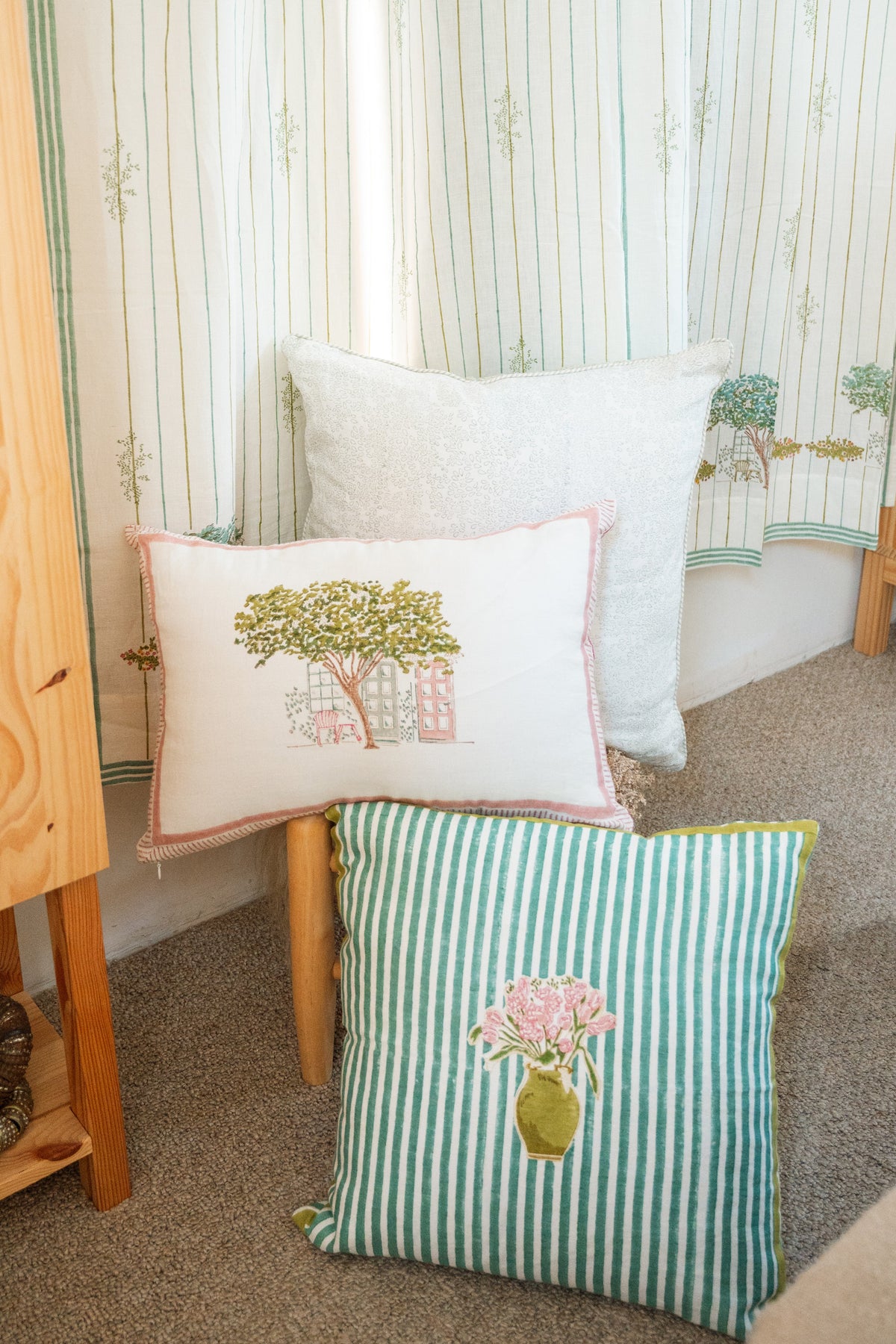 Embroidered flower throw pillow, teal and white stripes with pink floral pot and tree