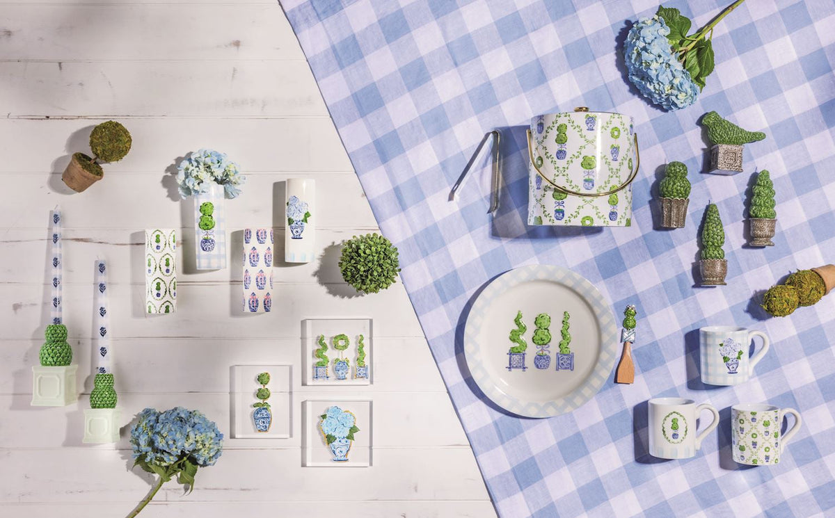 Ceramic topiary vases displayed on a tabletop, featuring blue-and-green patterns
