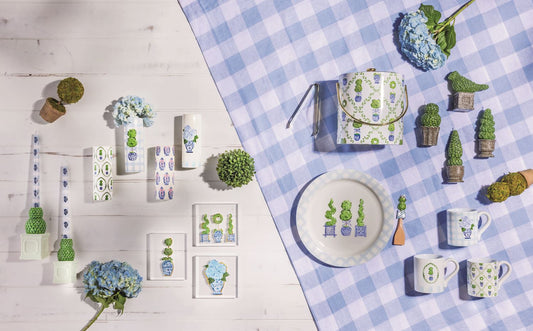 Ceramic topiary vases displayed on a tabletop, featuring blue-and-green patterns