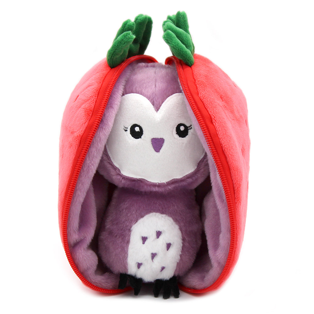 Plush owl in open red strawberry pouch, showing purple wings