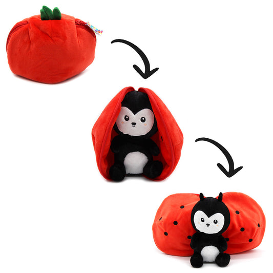 Red tomato-shaped plush with green stem, open shell revealing black ladybug plush
