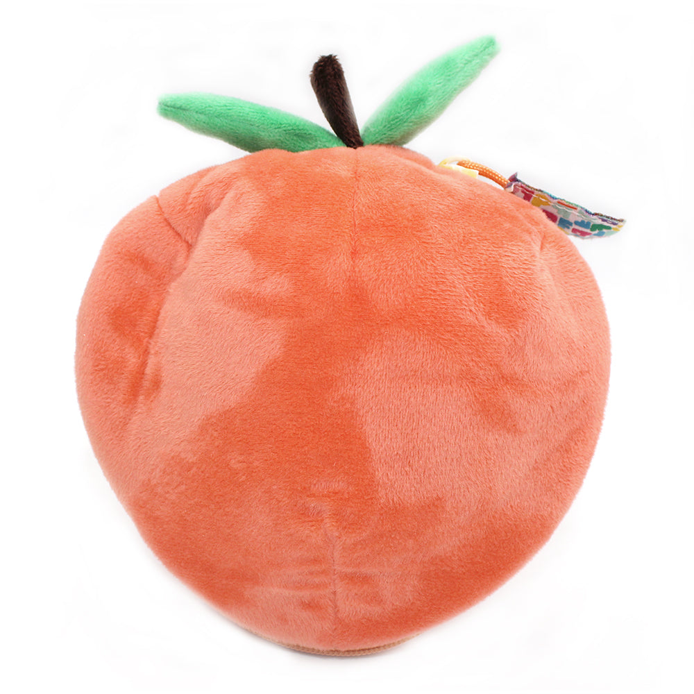 Peach orange plush turtle pouch with green leaf on top