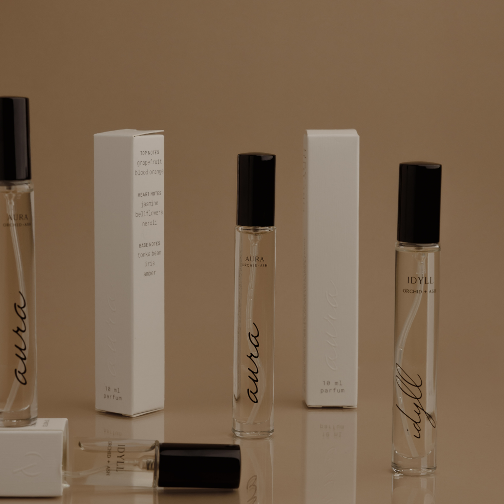 IDYLL Orchid + Ash travel spray bottle with black cap and matching white box