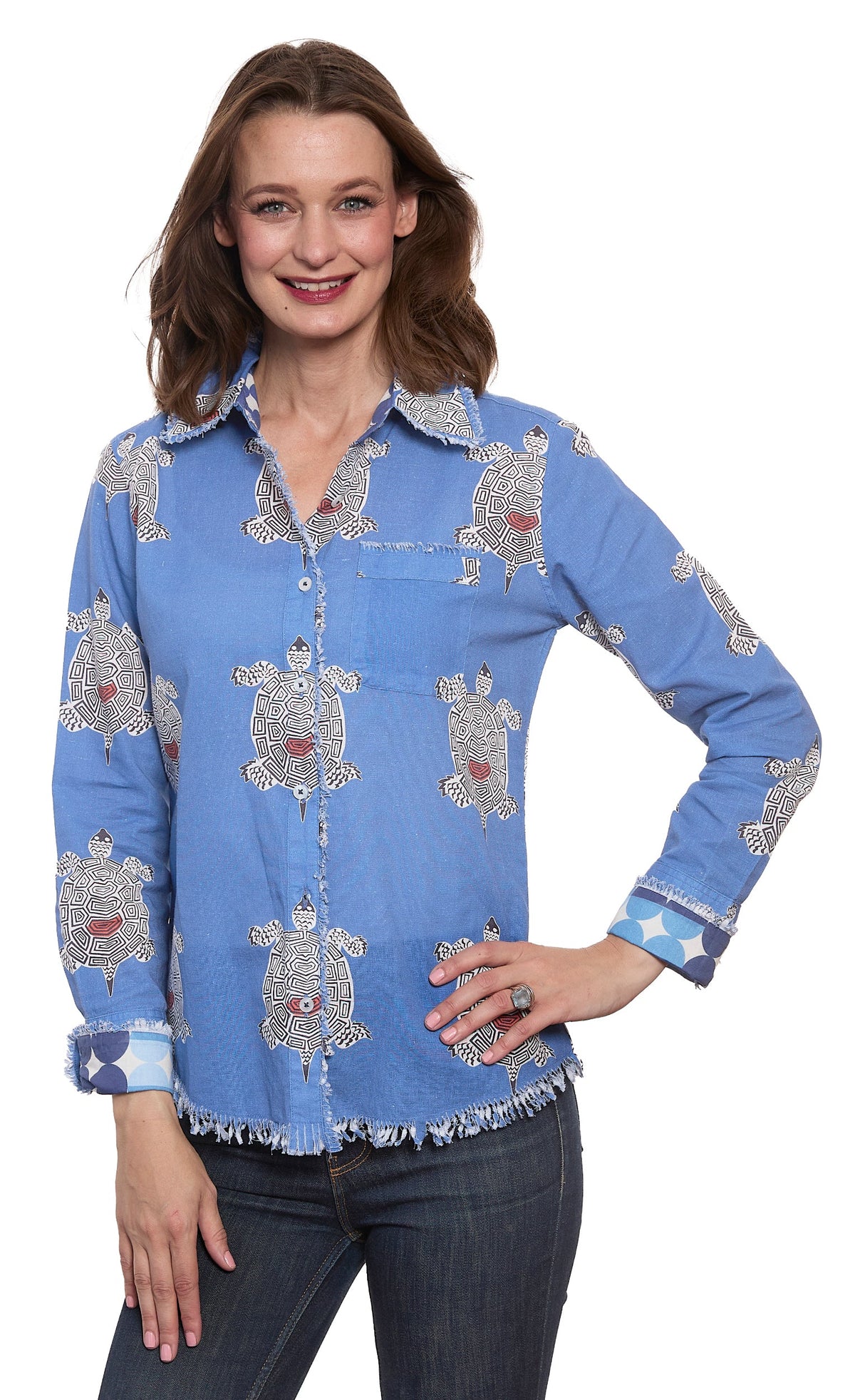 Blue turtle-print button-up top with long sleeves, collar, and fringe hem