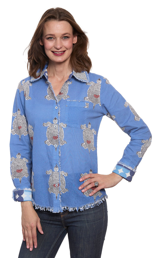 Blue turtle-print button-up top with long sleeves, collar, and fringe hem
