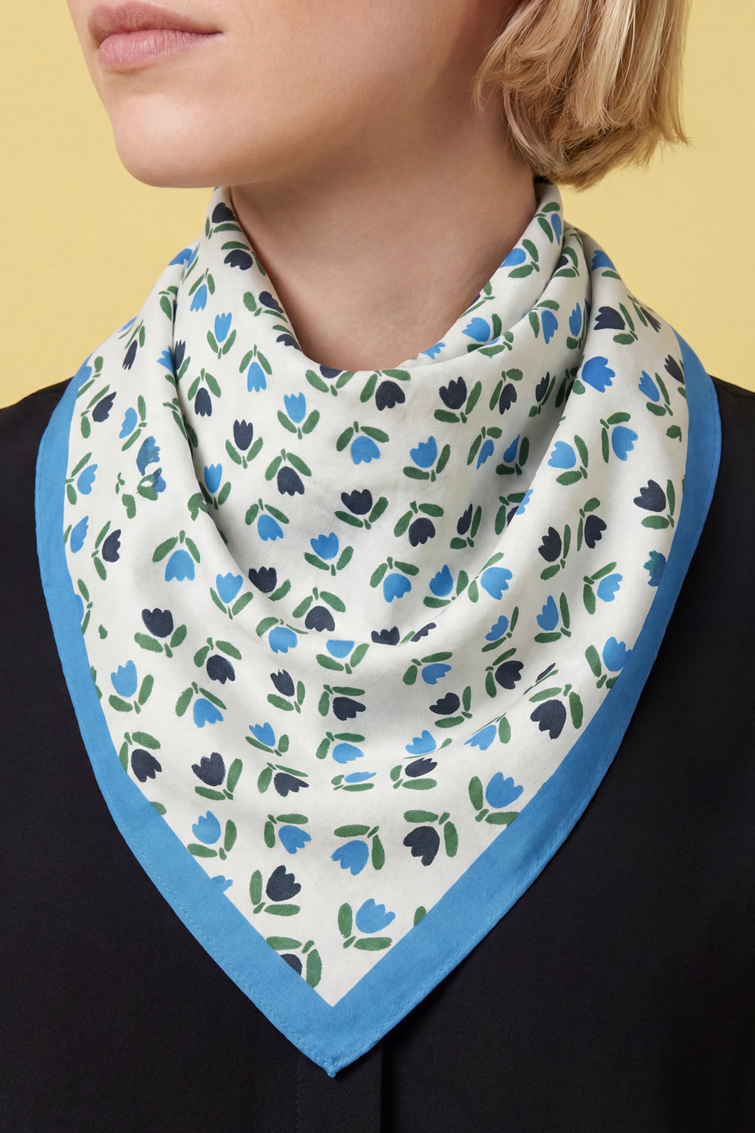 Tulip-print cotton bandana neck scarf with blue-trim edges.