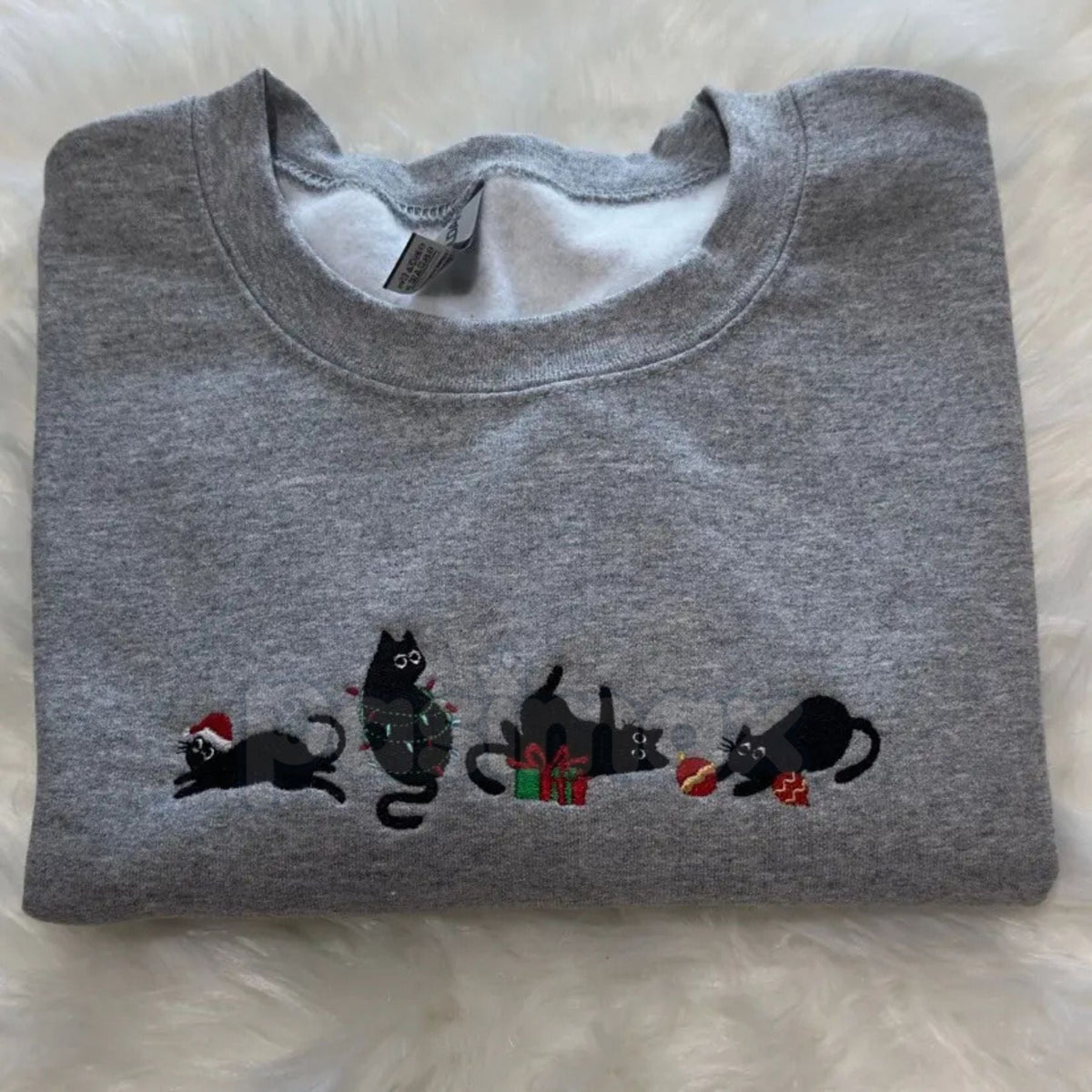 Heather gray crewneck sweatshirt with black cat holiday embroidery across the chest