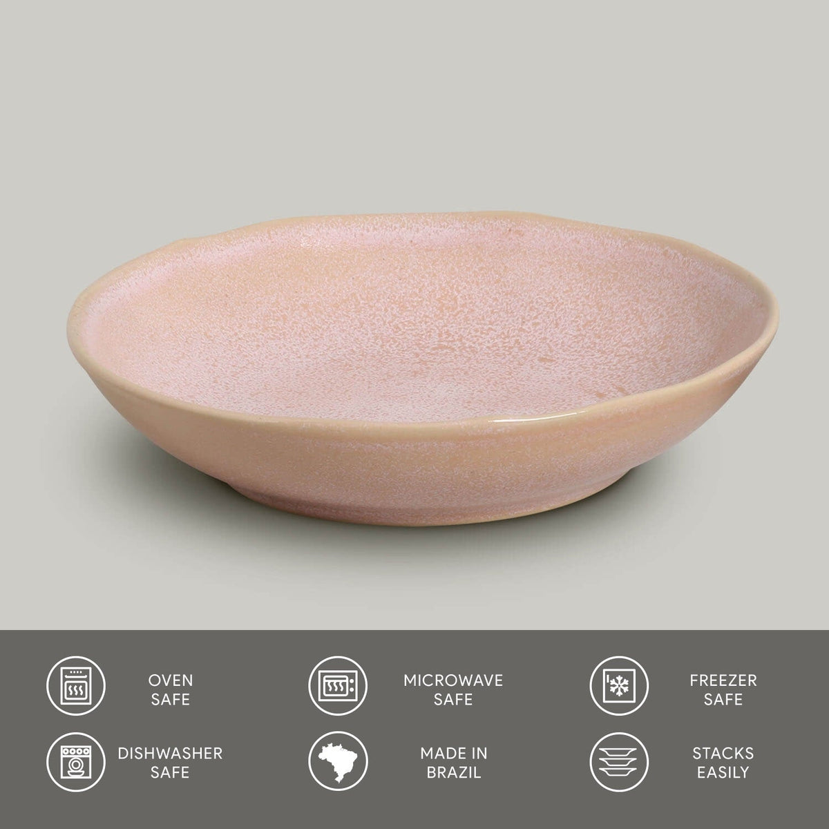 Pink ceramic pasta plate with speckled reactive glaze finish