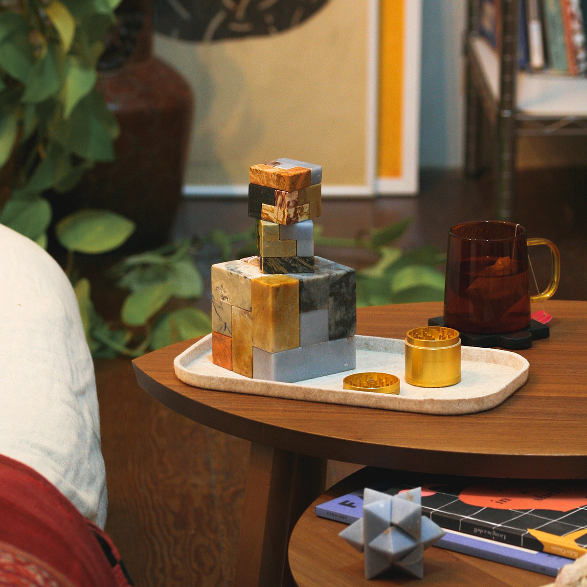 Gemstone Soma cube puzzle display with stacked cube and extra stone pieces