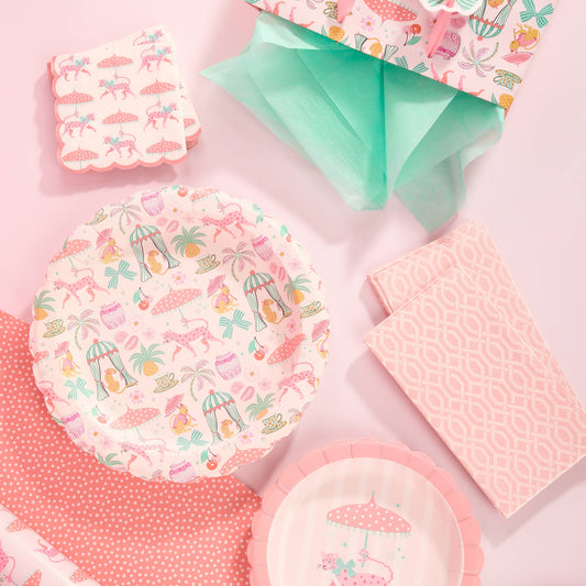 Scalloped pink lunch plates with tropical leopard and umbrella pattern, stacked