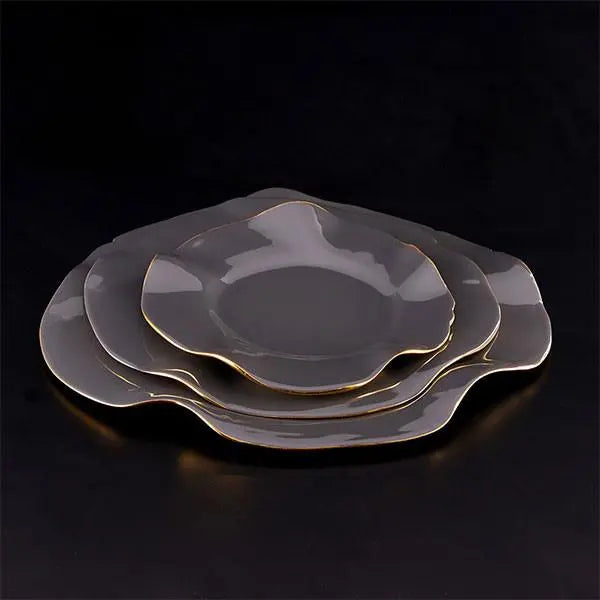 Graphite ruffled serving plate with wavy edge and gold trim, glossy finish