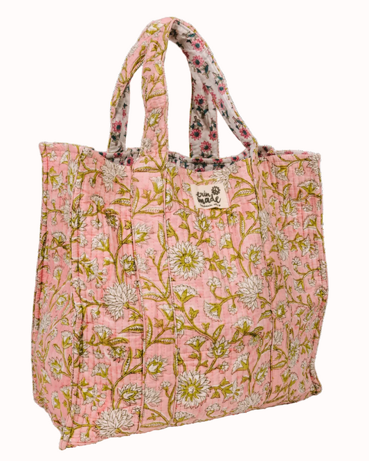 Pink floral tote bag with top handles and stitched center panel