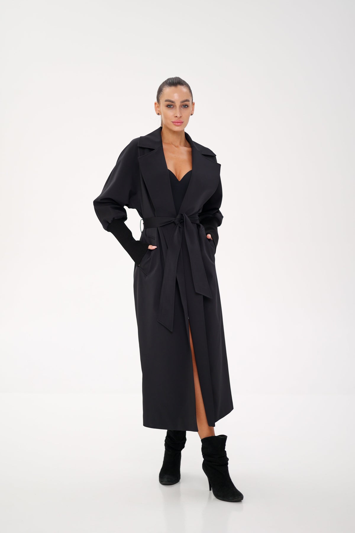 Black long trench coat with a belted waist and front slit