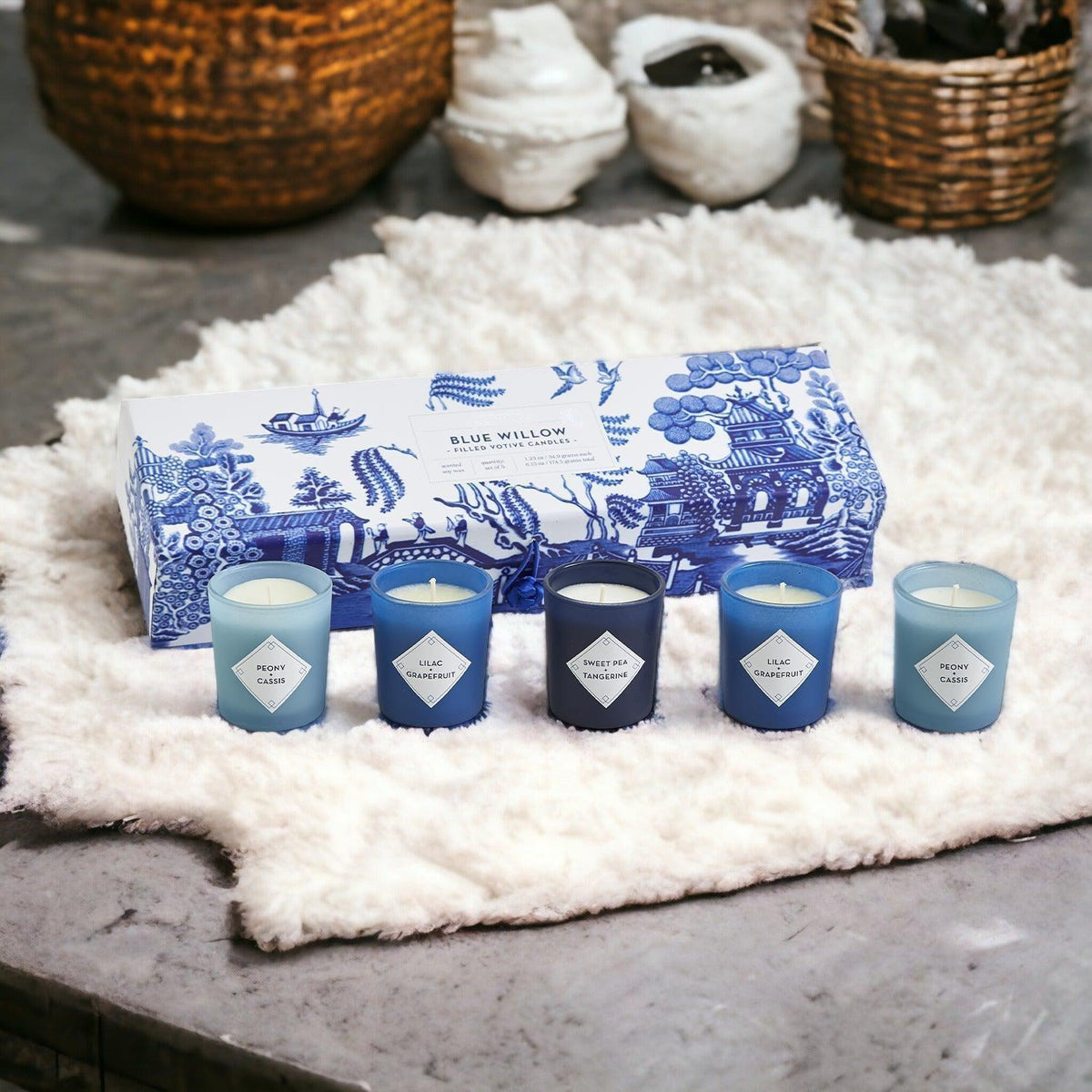 Mediterranean candle gift set with five candles on a white fluffy mat outdoors