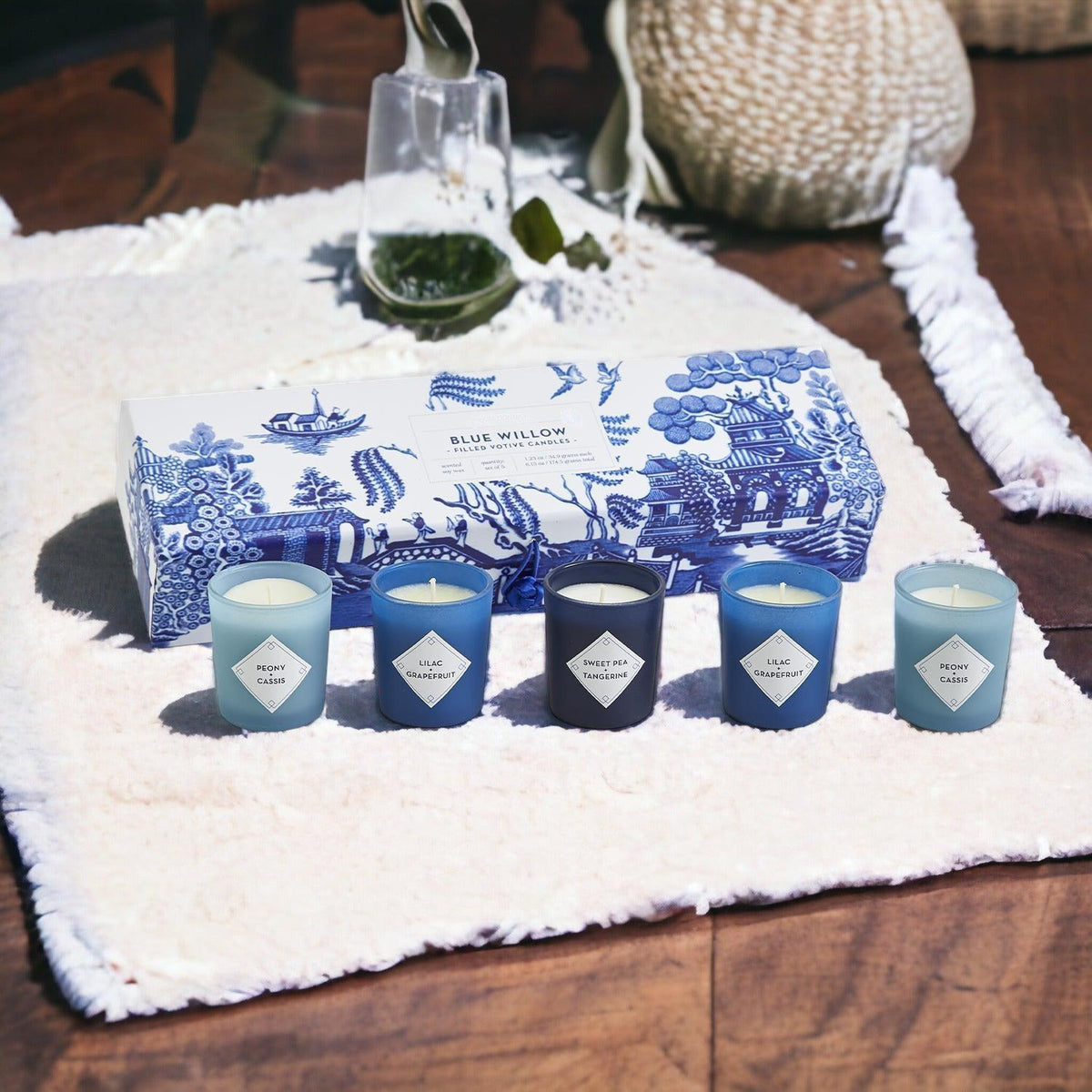 Mediterranean candle gift set with five candles in blue-and-white box on white mat