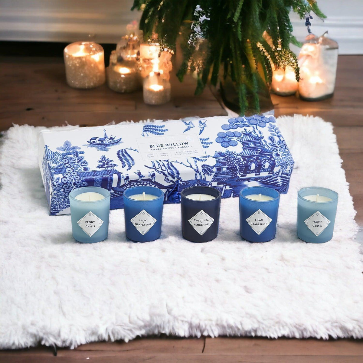 Mediterranean candle gift set with five blue and teal candles on a white rug