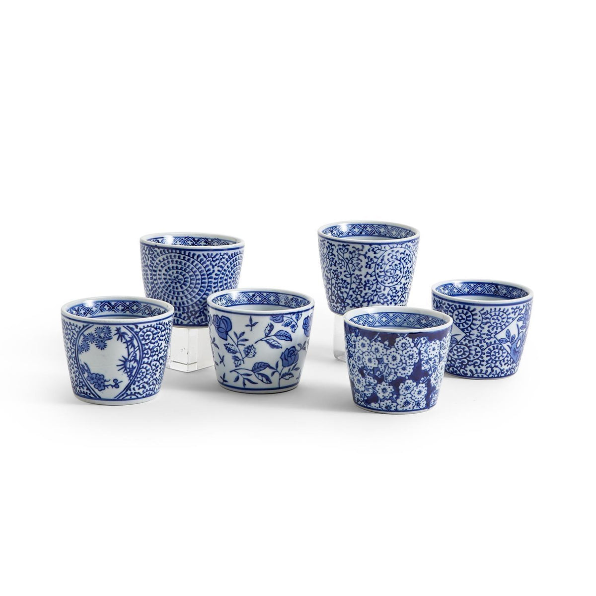 Assorted blue-and-white ceramic cachepots arranged in a group