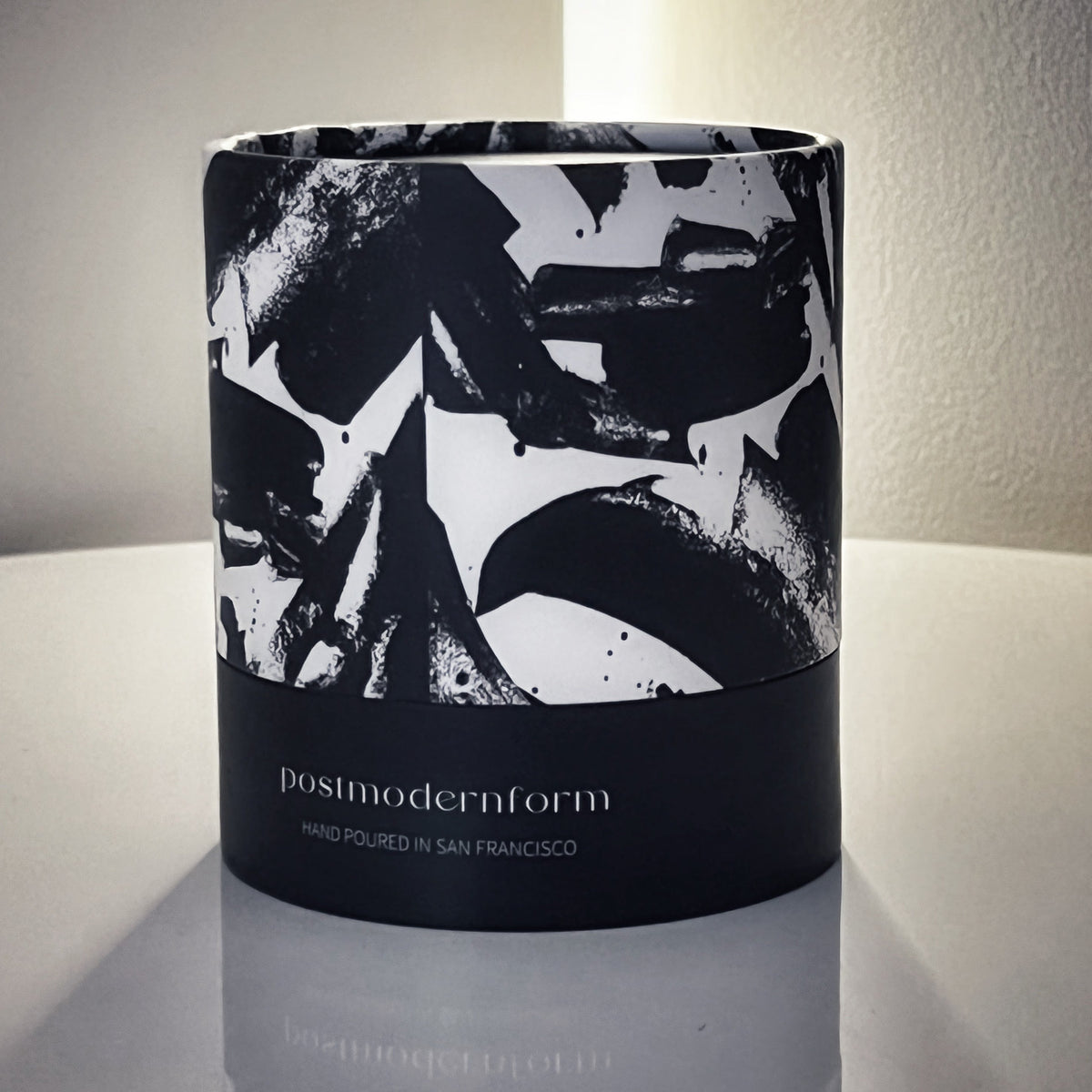 Postmodernform candle gift box with black-and-white abstract design and hand-poured text