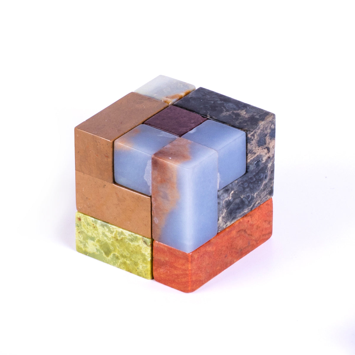 Gemstone cube puzzle with blue and orange blocks, white center panel, and dark accents.