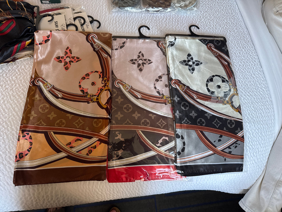 Large printed scarves in salmon, brown and cream, blush and brown, and black and cream