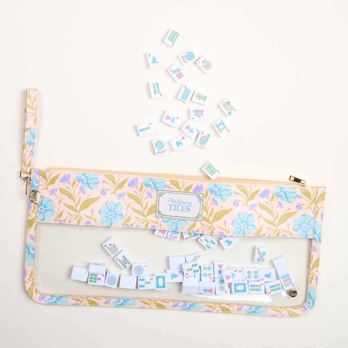 Floral Mahjong tile pouch with clear window and zipper, tiles visible inside; aqua accents