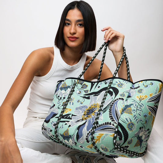 Mint floral tote bag with black trim, zip-top, and long striped handles