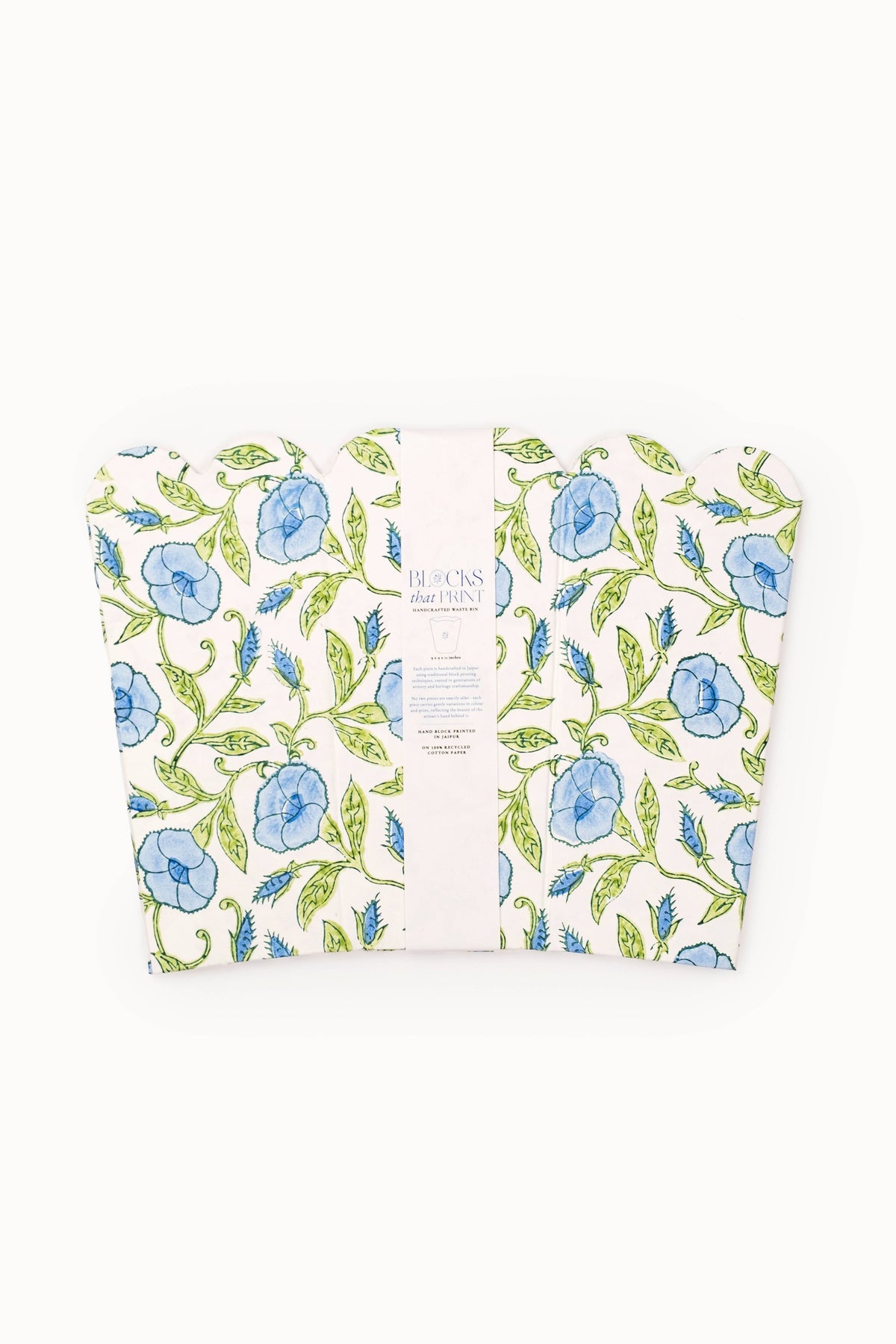 Collapsible fabric baskets with blue and green botanical block print, showing white label.