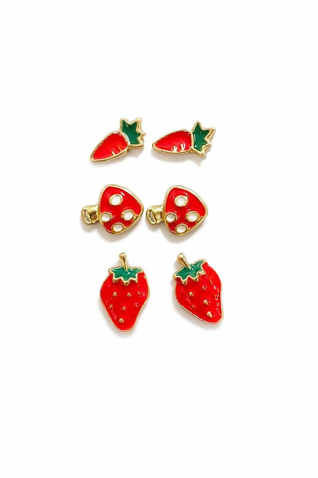 Three pairs of enamel food-themed stud earrings: strawberry, carrot, mushroom, gold-tone
