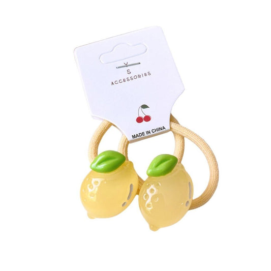 Set of 2 lemon-shaped hair ties with green leaf accents and yellow bands
