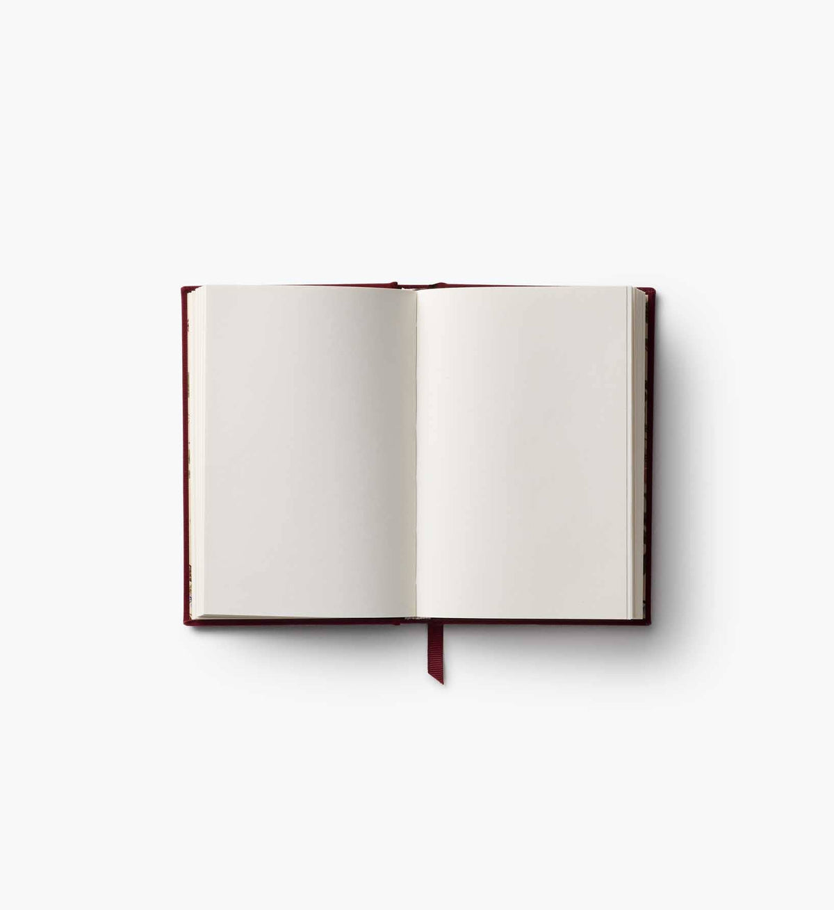 Mini embroidered journal open to blank pages, burgundy spine with ribbon bookmark