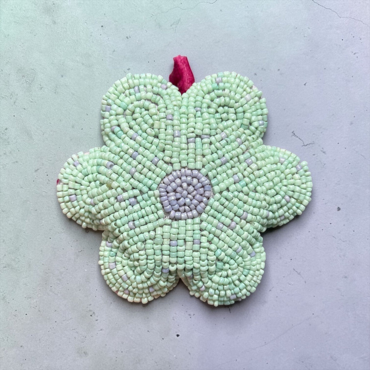 Glass beaded flower tape measure with mint-green flower and lilac center bead