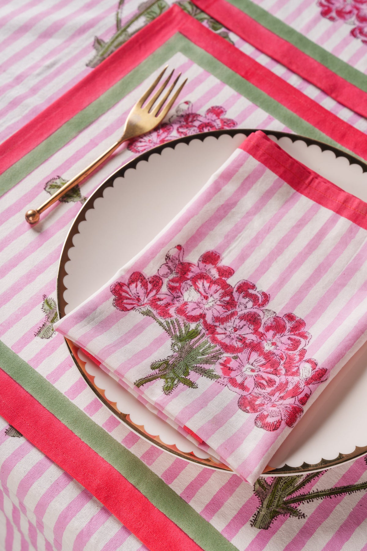 Set of pink striped blockprint napkins with hydrangea flowers and red-edged border